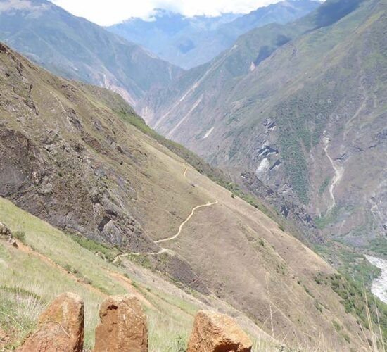 a look at the Choquequirao trail surrounded by beautiful landscapes and a river