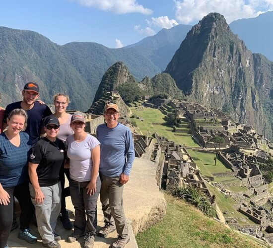 Machu Picchu PeruMachu Picchu and a group of people very happy to be in Machu Picchu