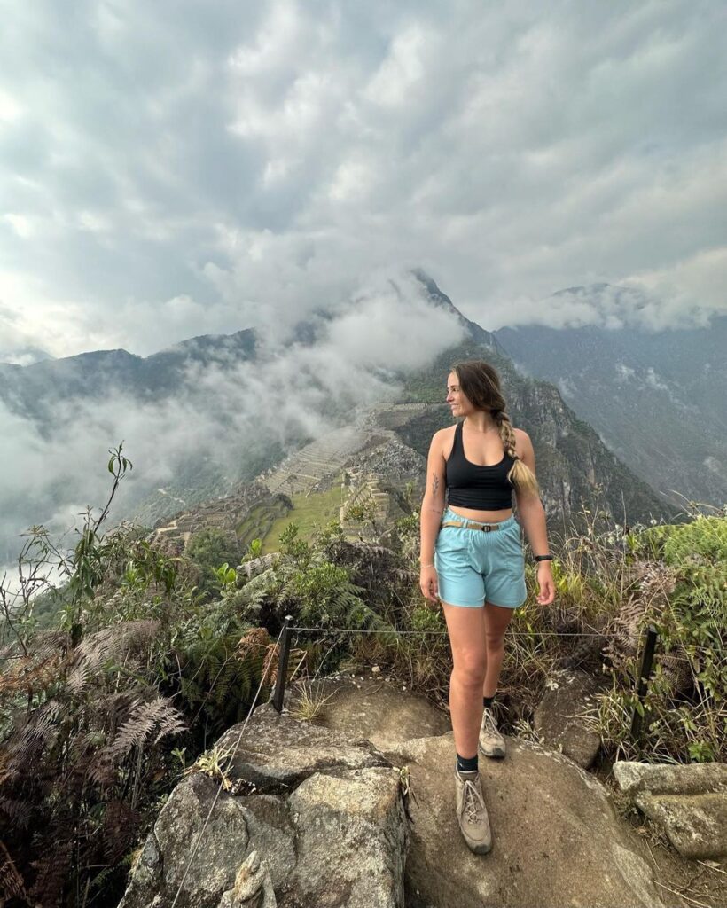 Inca Trail 2026: Your Comprehensive Trekking Guide 22 Woman posing at the viewpoint Huayna Picchu