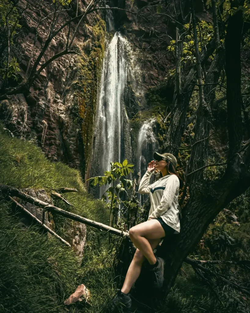 Ancascocha Trek: The Hidden Gem Trail to Machu Picchu 3 People next to Perolniyoc waterfall